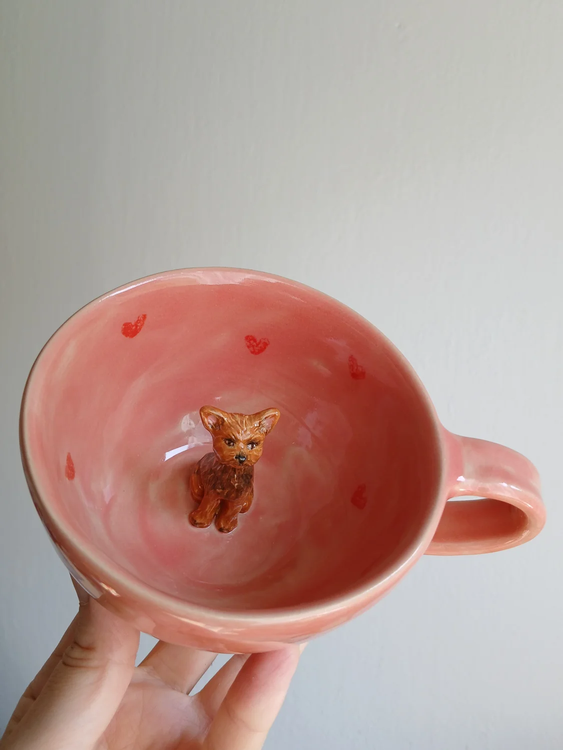 ●  Filiżanka/ kubek z pupilem w środku 